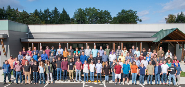 employees of Chroma standing in front of the manufacturing facility