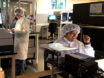 women engineers working machinery facility
